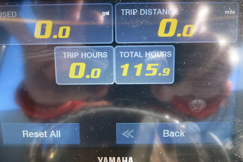 Slide: The Image of Dashboard display of a 2021 Sea Pro 239 Deep V CC showing trip and total hours. - 37