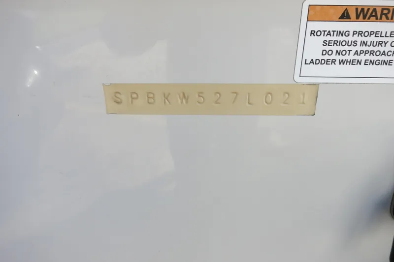 Slide: The Image of 2021 Sea Pro 239 Deep V CC hull identification number and safety warning label. - 43