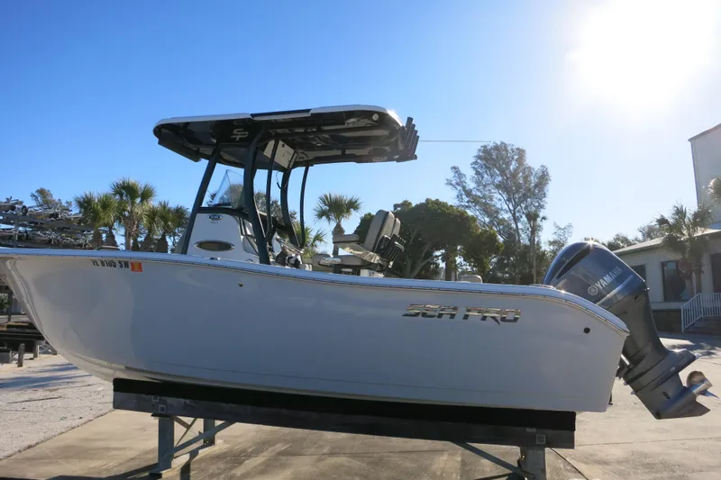 Slide: The Image of 2021 Sea Pro 239 Deep V CC boat with Yamaha outboard engine, parked outdoors. - 5