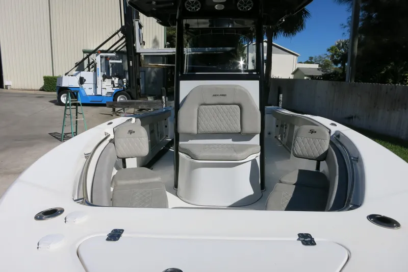 Slide: The Image of 2021 Sea Pro 239 Deep V CC boat interior with seating and console. - 50