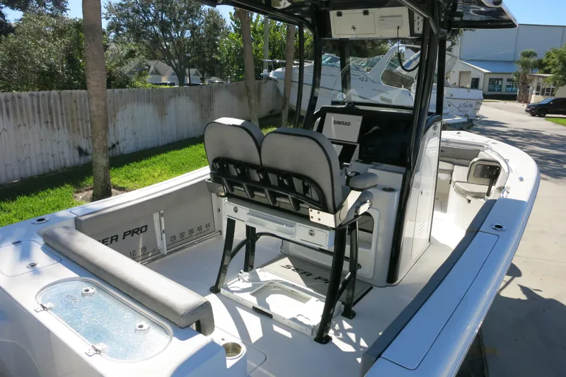 Slide: The Image of 2021 Sea Pro 239 Deep V CC boat interior with seating and console. - 51