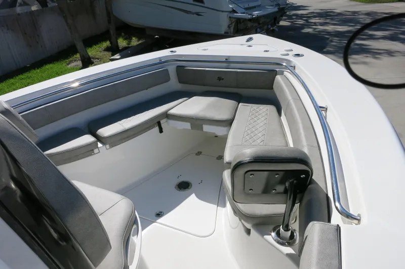 Slide: The Image of 2021 Sea Pro 239 Deep V CC boat interior with cushioned seating and stainless steel railings. - 57