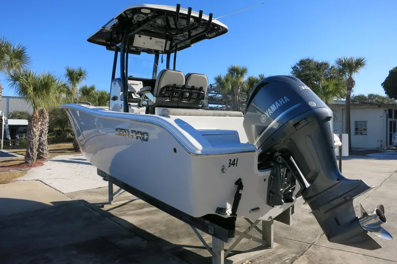 Slide: The Image of 2021 Sea Pro 239 Deep V CC boat with Yamaha engine, parked outdoors. - 6