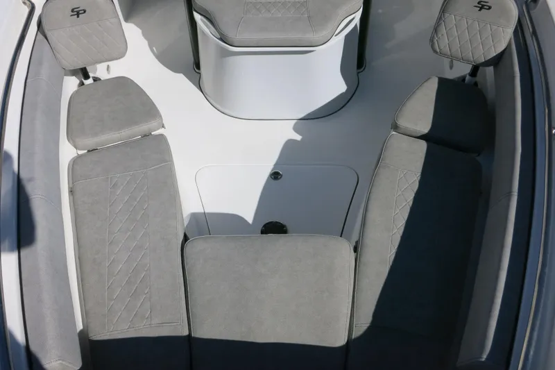Slide: The Image of 2021 Sea Pro 239 Deep V CC boat interior with gray cushioned seating. - 60