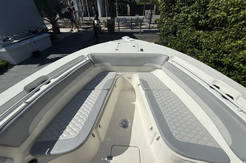 Slide: The Image of 2018 NauticStar 28 XS boat interior with cushioned seating and sleek design. - 10