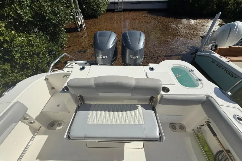 Slide: The Image of 2018 NauticStar 28 XS boat with dual 300 HP engines and seating area. - 12