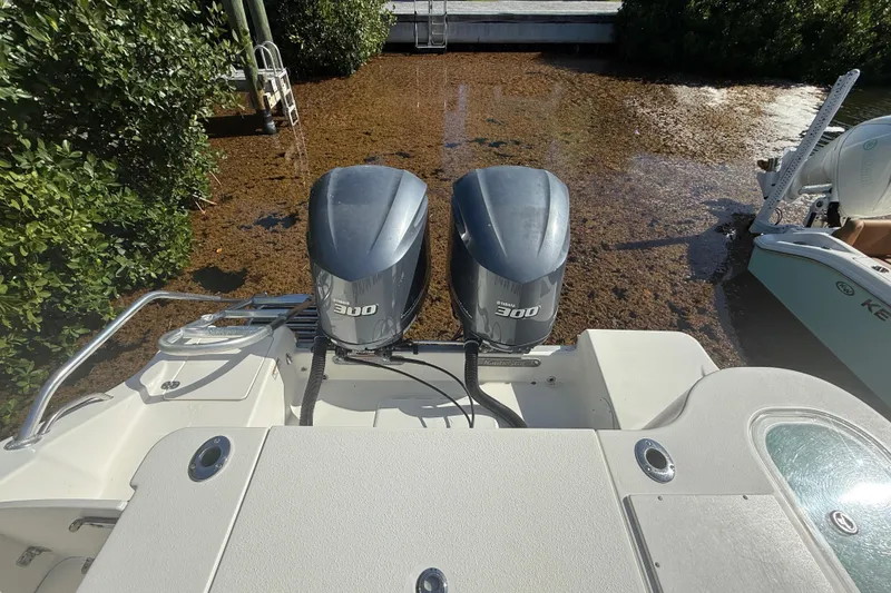 Slide: The Image of 2018 NauticStar 28 XS boat with twin Yamaha 300 engines in shallow water. - 14