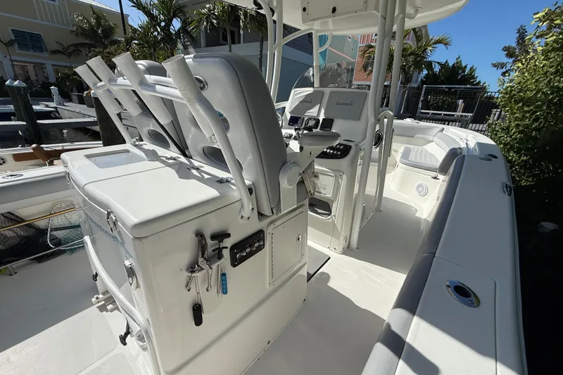 Slide: The Image of 2018 NauticStar 28 XS boat interior with seating and control panel. - 23