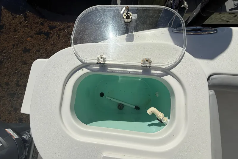 Slide: The Image of Open livewell on 2018 NauticStar 28 XS boat, showcasing interior features. - 34