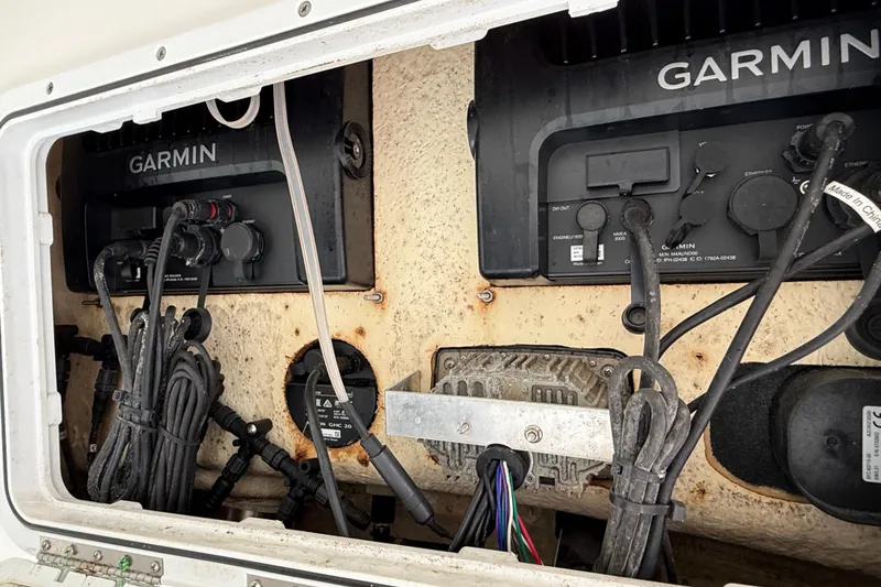 Slide: The Image of 2018 NauticStar 28 XS boat electronics with Garmin navigation systems and wiring. - 39