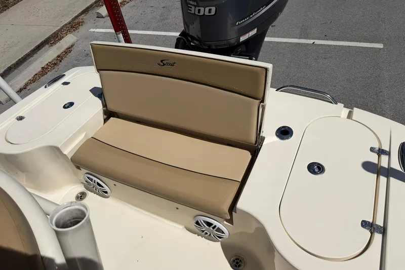 Slide: The Image of 2018 Scout 231 XS boat interior with beige seating and Yamaha 300 engine. - 11