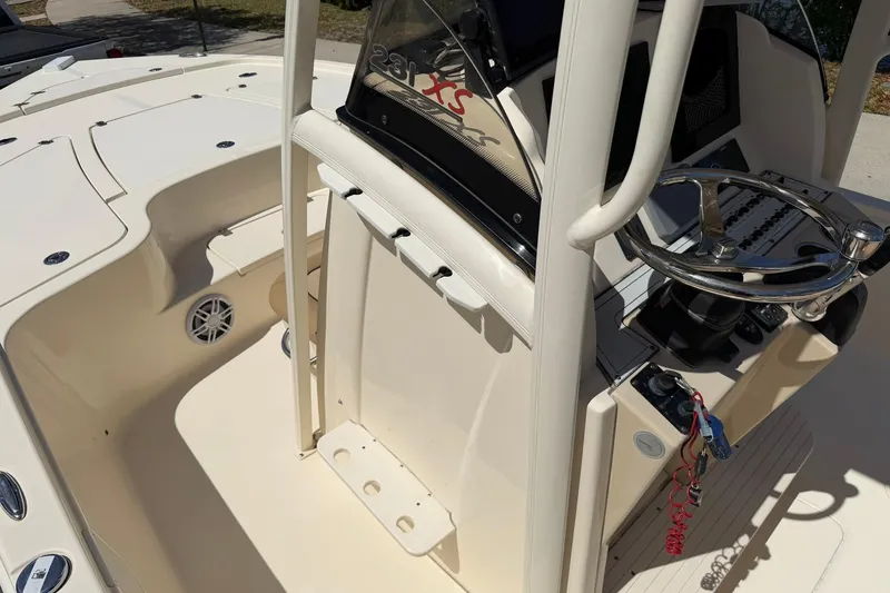 Slide: The Image of 2018 Scout 231 XS boat interior with steering wheel and console details. - 17