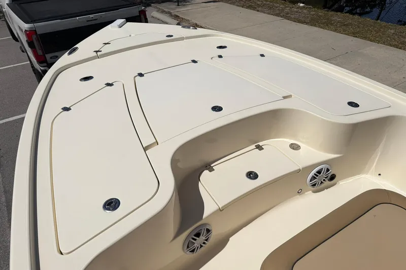 Slide: The Image of 2018 Scout 231 XS boat deck with storage compartments and speakers. - 18