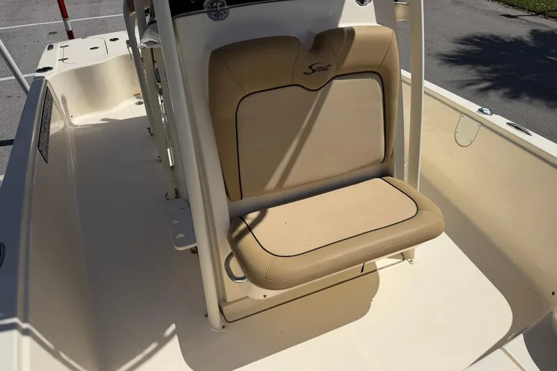 Slide: The Image of 2018 Scout 231 XS boat with tan seating and console. - 23
