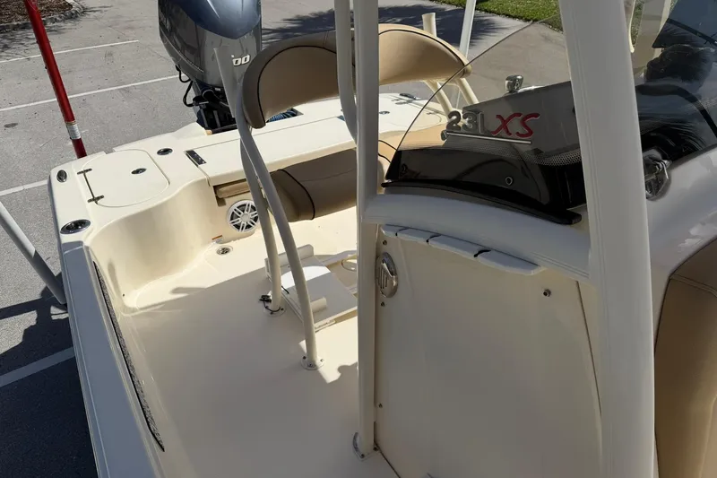 Slide: The Image of 2018 Scout 231 XS boat interior with seating and console details. - 25