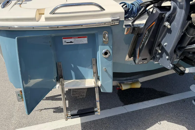 Slide: The Image of 2018 Scout 231 XS boat with open swim ladder and SeaStar hydraulic system. - 27