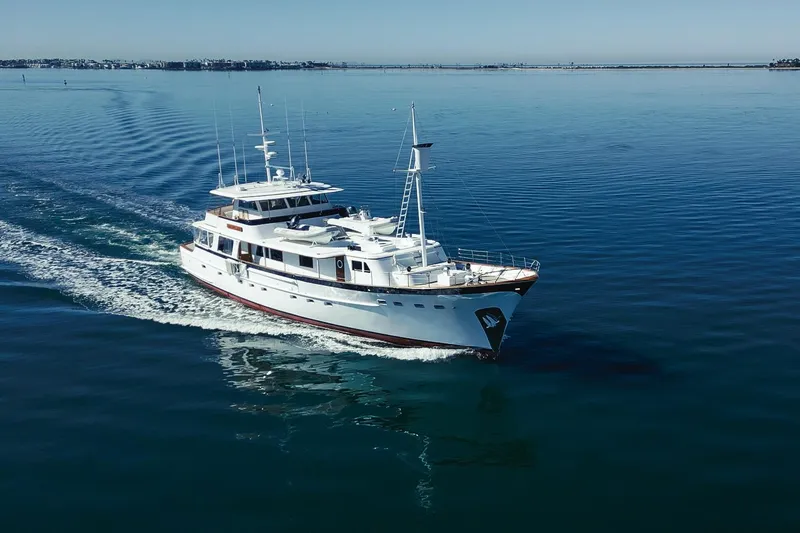 The Image of Custom 1969 Hargrave yacht cruising on calm blue waters. - 0