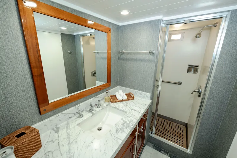 Slide: The Image of Luxurious 1969 Custom Hargrave yacht bathroom with marble countertop and modern shower. - 17
