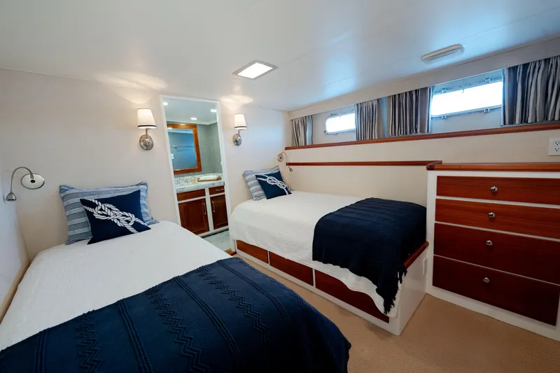 Slide: The Image of Luxurious 1969 Custom Hargrave yacht bedroom with twin beds and elegant decor. - 18