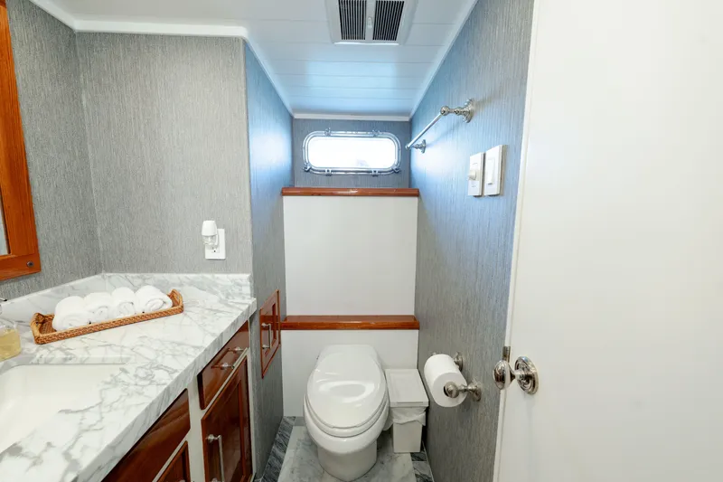 Slide: The Image of Luxurious 1969 Custom Hargrave yacht bathroom with marble countertop and modern fixtures. - 20