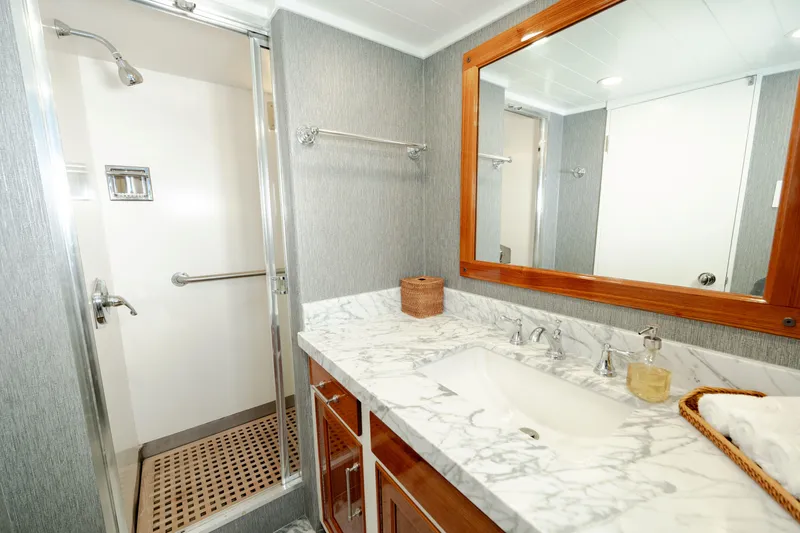 Slide: The Image of Luxurious 1969 Custom Hargrave yacht bathroom with marble countertop and spacious shower. - 21