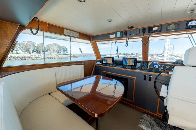 Slide: The Image of Interior of a 1969 Custom Hargrave yacht with navigation equipment and seating area. - 27