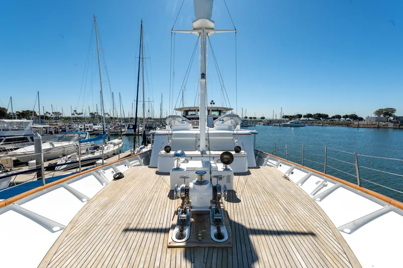 Slide: The Image of Custom 1969 Hargrave yacht deck with marina view under clear blue sky. - 28