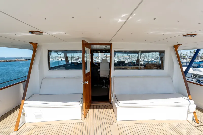 Slide: The Image of Luxurious 1969 Custom Hargrave yacht interior with white seating and ocean view. - 31