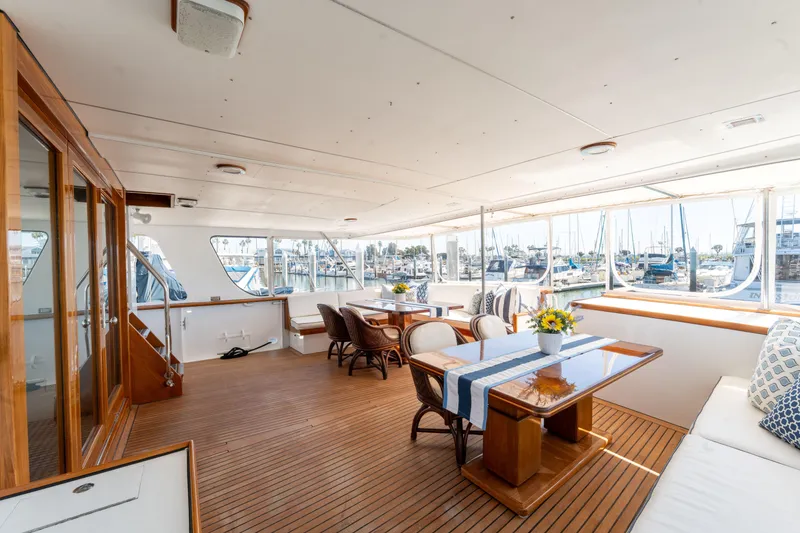 Slide: The Image of Luxurious 1969 Custom Hargrave yacht interior with elegant dining area and marina view. - 33