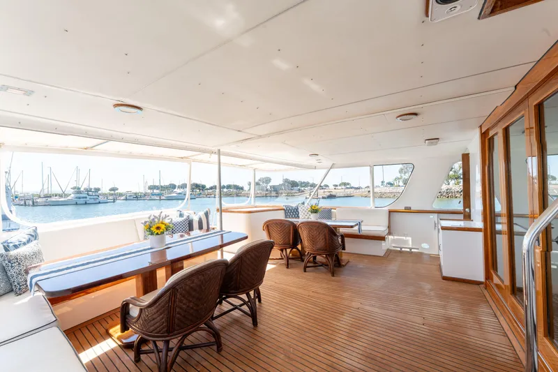 Slide: The Image of Spacious deck of 1969 Custom Hargrave yacht with elegant seating and waterfront view. - 34
