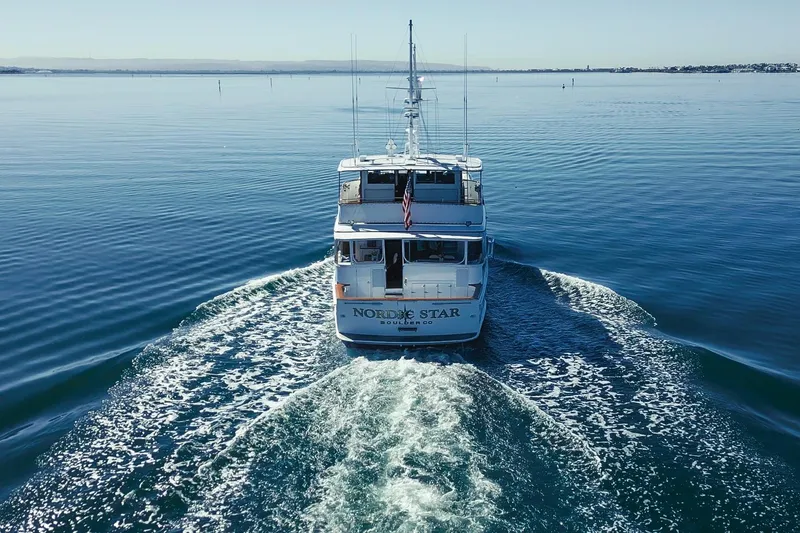 Slide: The Image of Custom 1969 Hargrave yacht cruising on calm waters, rear view. - 36