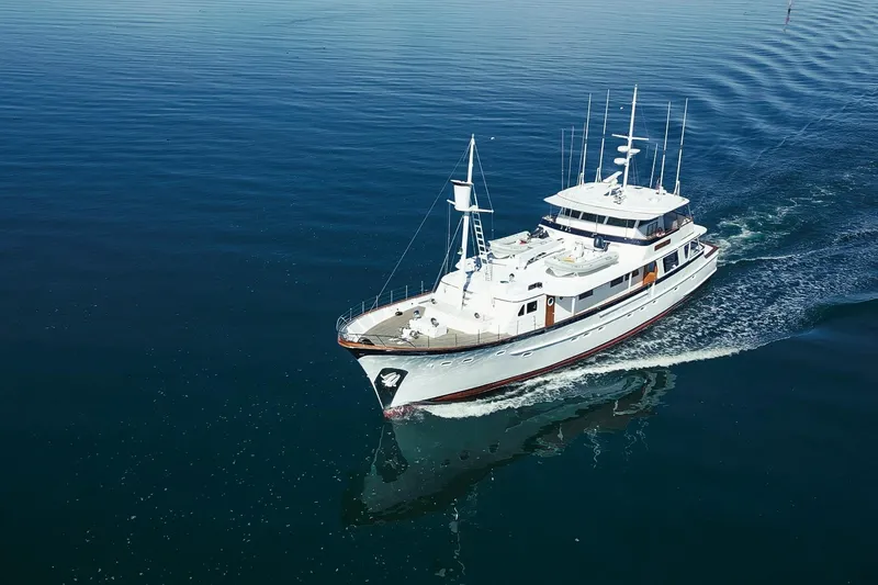 Slide: The Image of Custom 1969 Hargrave yacht cruising on calm blue waters. - 38