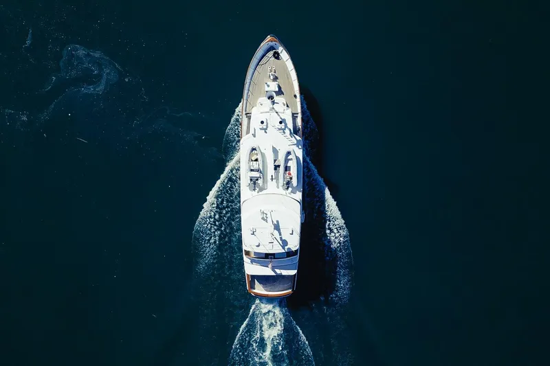 Slide: The Image of Aerial view of 1969 Custom Hargrave yacht cruising on dark blue water. - 39