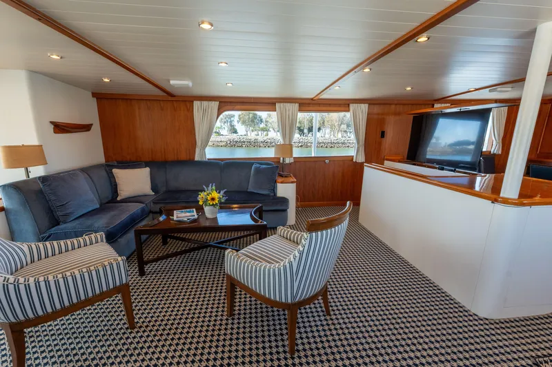 Slide: The Image of Luxurious 1969 Custom Hargrave yacht interior with elegant seating and large windows. - 4