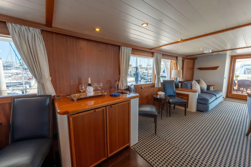 Slide: The Image of Luxurious 1969 Custom Hargrave yacht interior with elegant wood paneling and comfortable seating. - 5