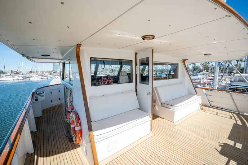 Slide: The Image of Spacious deck of 1969 Custom Hargrave yacht with seating, docked at marina. - 30