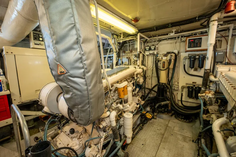 Slide: The Image of Engine room of a 1969 Custom Hargrave yacht, showcasing machinery and equipment. - 42