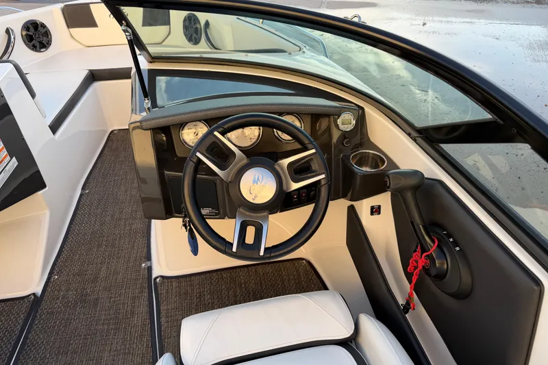 Slide: The Image of 2017 Monterey 196FS boat cockpit with steering wheel and dashboard controls. - 19