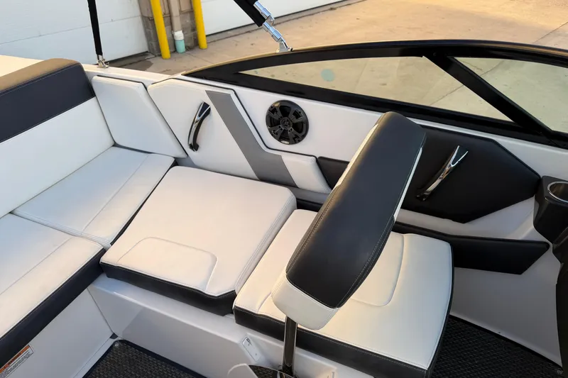 Slide: The Image of 2017 Monterey 196FS boat interior with white and black seating and speaker. - 22