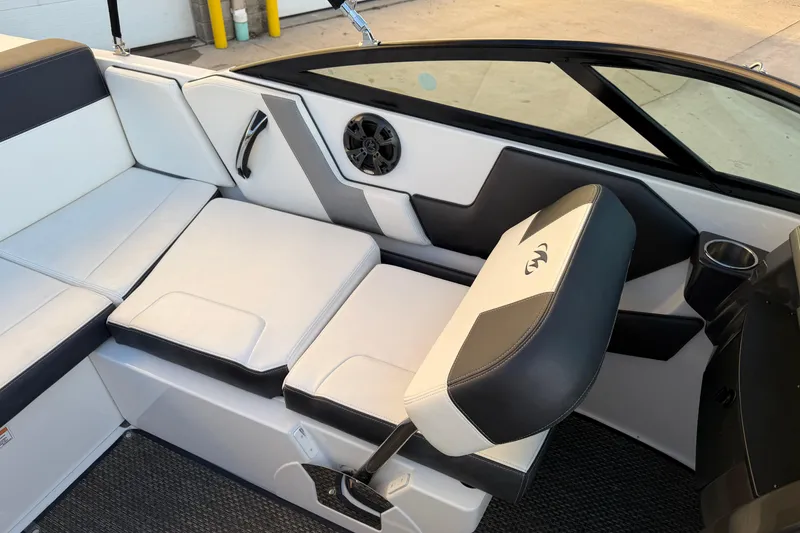 Slide: The Image of Interior of a 2017 Monterey 196FS boat with white and black seating. - 23