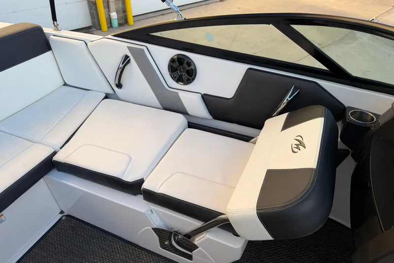 Slide: The Image of 2017 Monterey 196FS boat interior with white and black seating and speaker. - 24