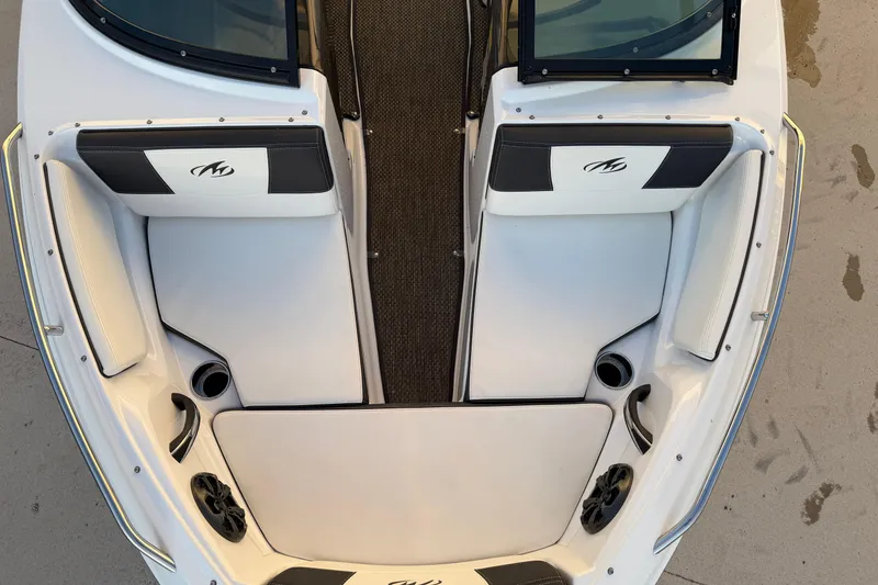 Slide: The Image of 2017 Monterey 196FS boat interior with white seating and cup holders. - 25