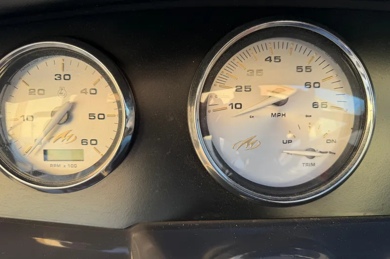 Slide: The Image of Dashboard gauges of a 2017 Monterey 196FS boat, displaying RPM and speed in MPH. - 39