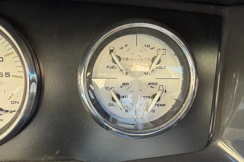 Slide: The Image of Dashboard gauges of a 2017 Monterey 196FS boat, displaying fuel, voltage, oil, and temperature. - 40