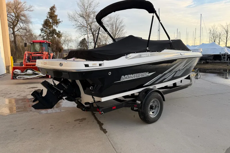 Slide: The Image of 2017 Monterey 196FS boat on trailer, black and white design, parked outdoors. - 5