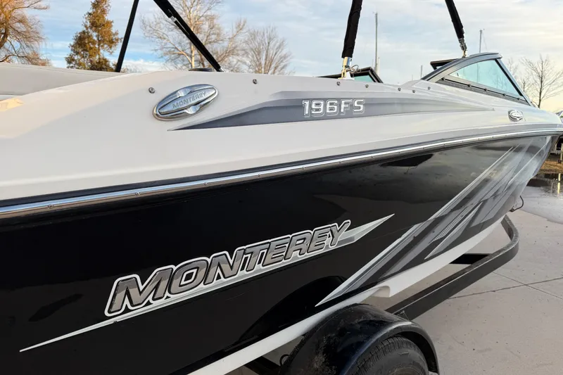 Slide: The Image of 2017 Monterey 196FS boat with sleek black and white design on a trailer. - 7