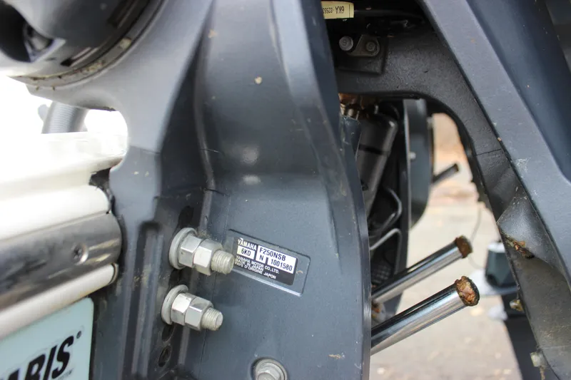 Slide: The Image of Close-up of a 2022 Cobia 280 Center Console boat engine components. - 13