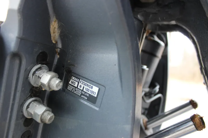 Slide: The Image of Close-up of Yamaha F250NSB engine part on 2022 Cobia 280 Center Console boat. - 14