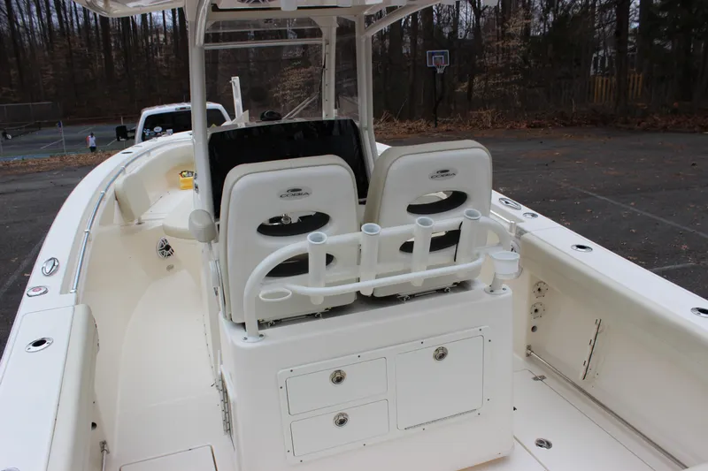 Slide: The Image of 2022 Cobia 280 Center Console boat interior with seating and storage compartments. - 17