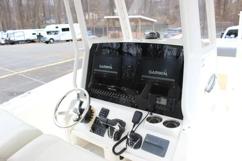 Slide: The Image of 2022 Cobia 280 Center Console boat dashboard with Garmin navigation system. - 28